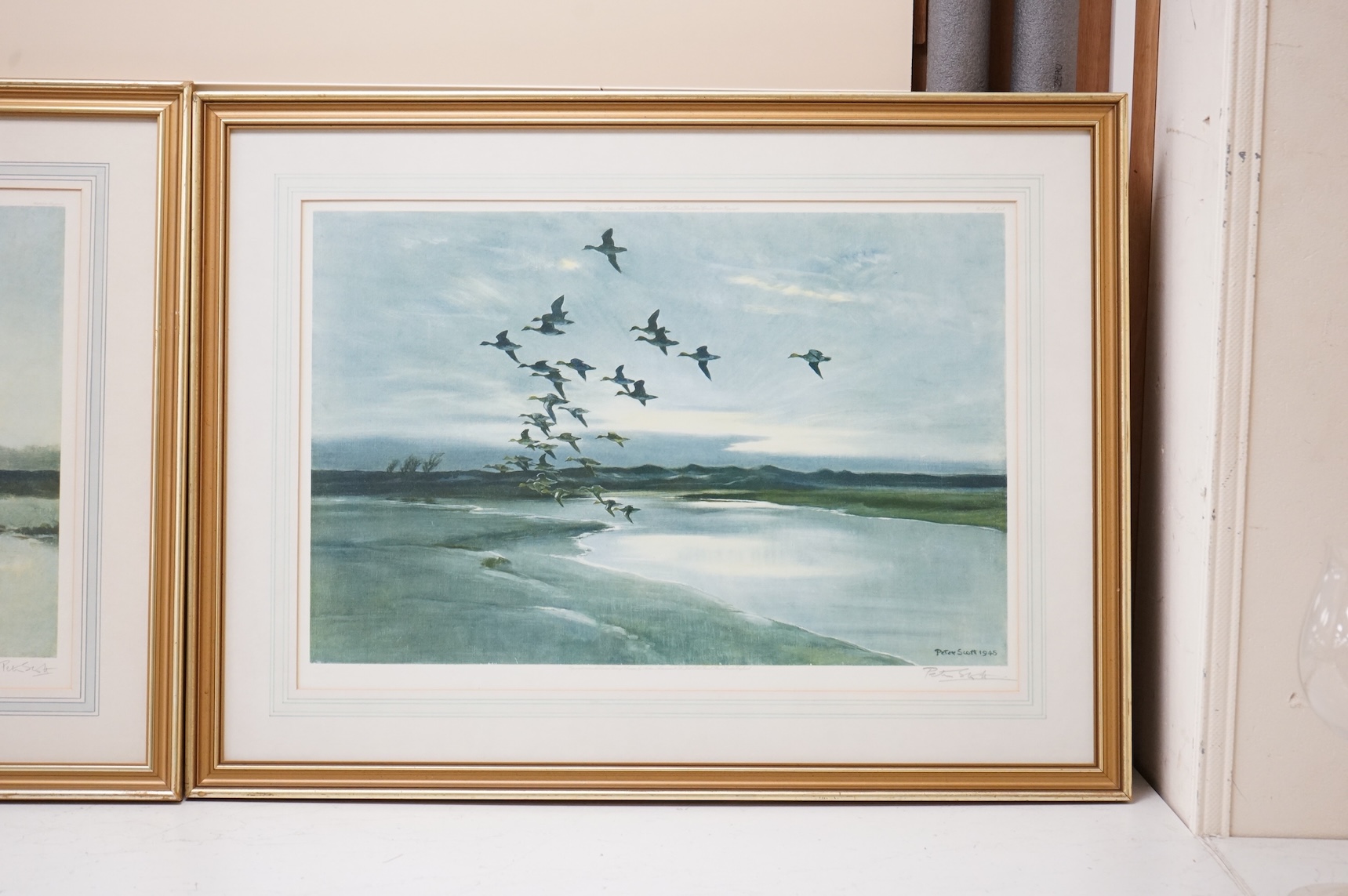 Sir Peter Markham Scott (1909-1989) ‘Widgeons beyond the dunes’ and ‘Mallard in a mellow sky’, each signed in pencil, each with labels verso, pair of colour prints, published by Arthur Ackermann & Son Ltd., 1946 and 1949